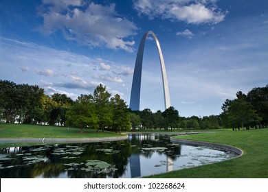 Gateway Arch. Gateway Arch, trees, and lake in the Jefferson National Expansion Memorial in St. Louis, MO