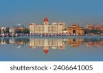 The Gateway of India and boats in the background Taj Mahal Hotel - Mumbai, India