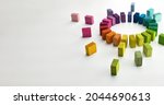 Gathering, centralization, of data and people, concept image.
Circle of colorful wooden blocks representing unity of diverse elements. Isolated on neutral white.