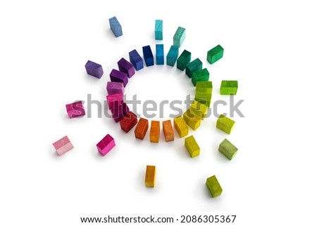 Gathering, centralization of data and people, concept image.
Circle of colorful wooden blocks representing unity of diverse elements. Isolated on neutral white.