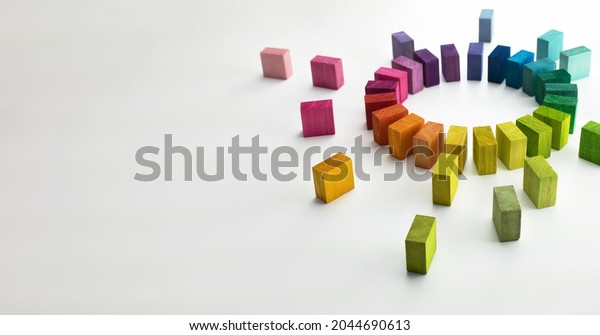 Gathering, centralization, of\
data and people, concept image.\
Circle of colorful wooden blocks\
representing unity of diverse elements. Isolated on neutral\
white.