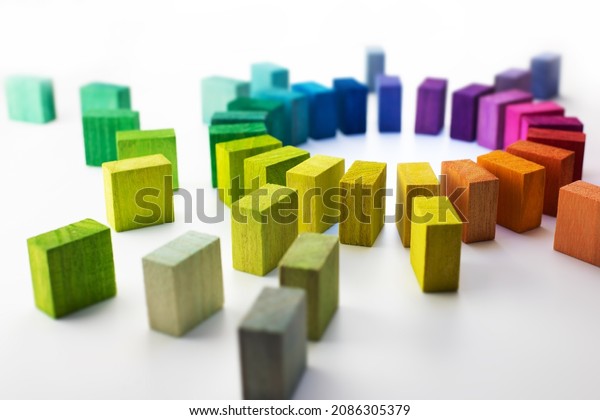 Gathering, centralization, of\
data and people, concept image.\
Circle of colorful wooden blocks\
representing unity of diverse elements. Isolated on neutral\
white.