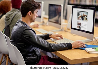 Gathering Facts Online. Shot Of Students Working On Computers In A University Library.