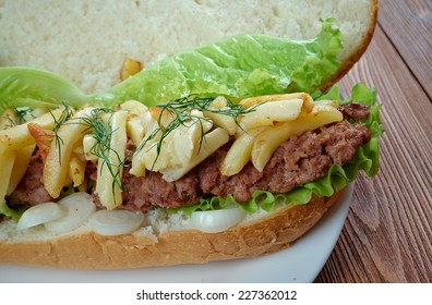 Gatsby  - South African sandwich.Different varieties of Gatsbys include masala steak, chicken, polony, Vienna sausage, calamari, fish, and chargrilled steak.