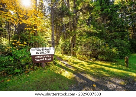 Gaudineer knob sign in Monongahela National Forest Appalachian mountains West Virginia hiking scenic trail entrance to moss forest in morning sunrise