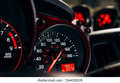 Gauge cluster focused on the 180 MPH max speed speedometer resting at 0 MPH