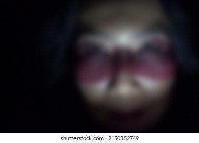 Gaussian Blur Image Of Asian Woman Face With Excessive Eye Make Up 