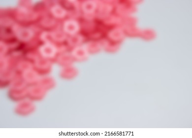 Gaussian Blur Of Pink Sakura Shape Garment Buttons For Background 