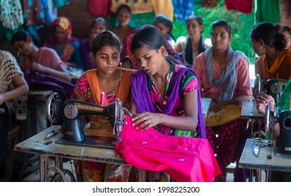 Gautam Budh Nagar, Uttar Pradesh, India-Sep 12 2016: Girls And Women Learning Stitching And Tailoring Under Vocational Training Course. Empowering Women Through Stitching  Tailoring Classes