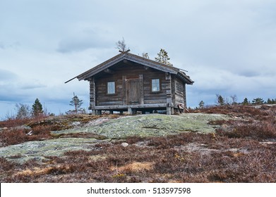 Gautefall, Norway - May 2, 2015:  Wooden house in the mountains Gautefall. Green roof. Early spring.