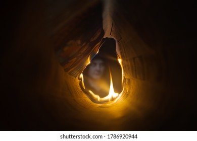 Gauteng, Germiston, South Africa, 04 23 2020 Perspective Portrait Through Burning Newspaper,