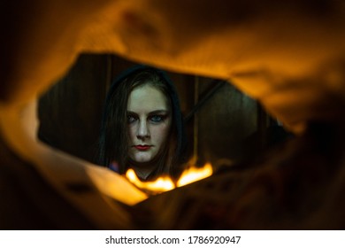 Gauteng, Germiston, South Africa, 04 23 2020 Perspective Portrait Through Burning Newspaper,