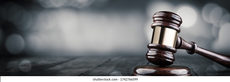 Gavel And Block On Wooden Desk With Bokeh Background - Law And Justice / Auction Concept - Shutterstock ID 1742766599