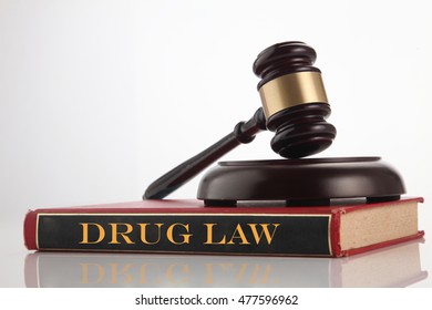 gavel and hammer on top of book "Drug Law."