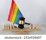 Gavel for judge lawyer with heart rainbow flag, symbol of LGBT pride month.