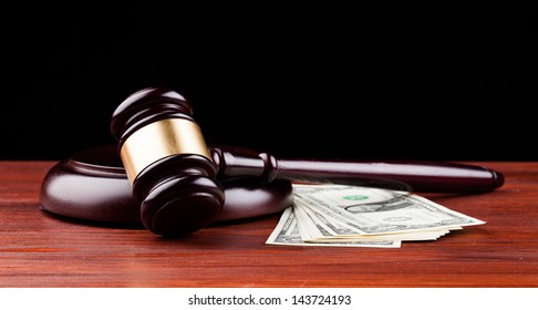 Gavel And Money Isolated On Black