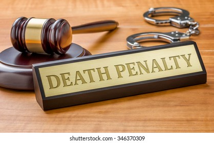 A Gavel And A Name Plate With The Engraving Death Penalty