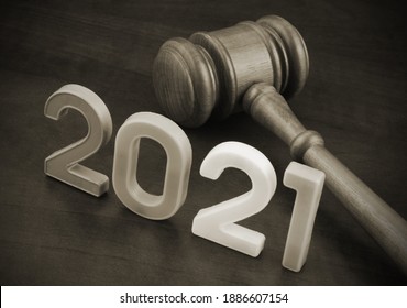 Gavel And Numbers 2021 On Wooden Table. Concept Of New Laws And Rules.