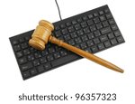 Gavel on computer keyboard close up