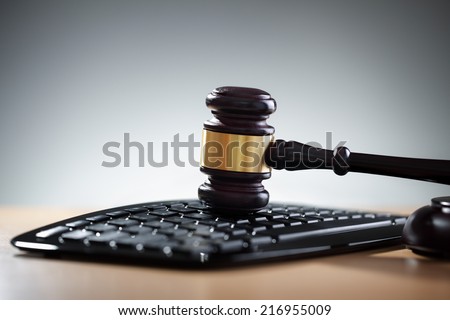 Gavel on computer keyboard concept for online internet auction or legal assistance