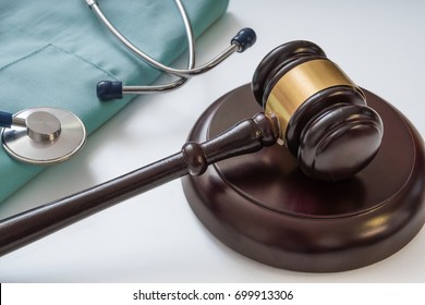 Gavel And Stethoscope In Background. Medical Laws And Legal Concept.