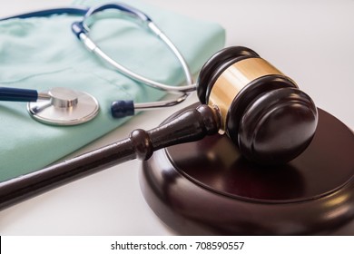 Gavel and stethoscope in background. Medical laws and legal concept. - Shutterstock ID 708590557