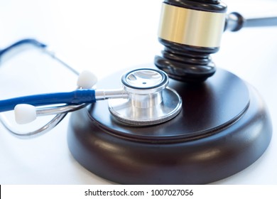 Gavel And Stethoscope. Medical Jurisprudence. Legal Definition Of Medical Malpractice. Attorney. Common Errors Doctors, Nurses And Hospitals Make