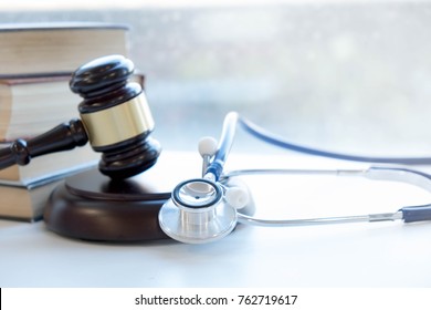 Gavel and stethoscope. medical jurisprudence. legal definition of medical malpractice. attorney. common errors doctors, nurses and hospitals make. - Shutterstock ID 762719617