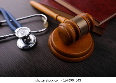 Gavel And Stethoscope On Wooden Background, Symbol Photo For Bungling And Medical Error. Medicine Laws And Legal, Medical Jurisprudence.