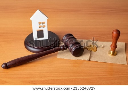 gavel and toy house. law judge contract court legal trust legacy stamp