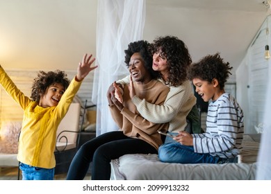 Gay Couple Children Love Happiness Concept. Happy Multiethnic Family Spending Time Together At Home