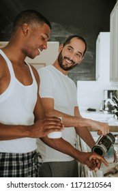 Gay Couple Cooking In The Morning