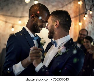 Gay couple dancing on wedding day