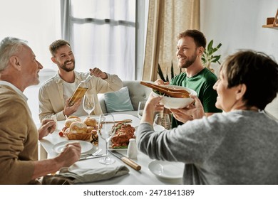 A gay couple enjoys a meal with parents at home. - Powered by Shutterstock