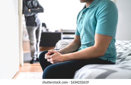 Gay Couple In Fight. Sad Man In Argument. Male Friends Or Brothers In Conflict. Stress Or Crisis In Relationship. Infidelity And Cheating Or Jealousy And Mistrust. Upset Guy Sitting On Bed At Home.