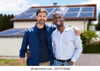 Gay Couple In Front Of New House With Solar Panel Roof