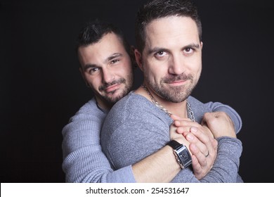 A Gay Couple On Black Background Studio