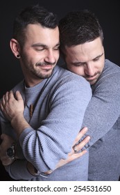 A Gay Couple On Black Background Studio