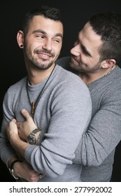 A Gay Couple On Black Background Studio