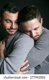 A Gay Couple On Black Background Studio