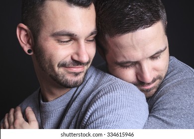 A Gay Couple On Black Background Studio