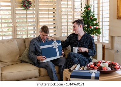 Gay Couple Opening Gifts On Christmas Morning