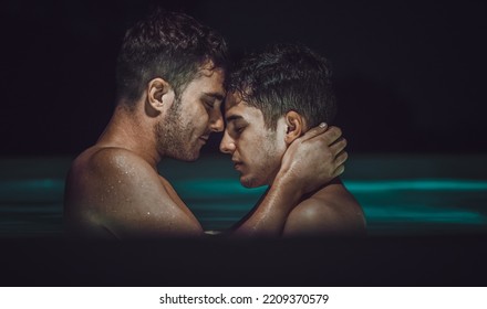 Gay Couple Relaxing In Swimming Pool. LGBT. Two Young Men Kissing And Hugging. Young Men Romantic Family In Love. Happiness Concept