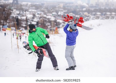 Gay Couple Snowboarders Posing For A Photograph