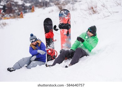 Gay Couple Snowboarders Posing For A Photograph