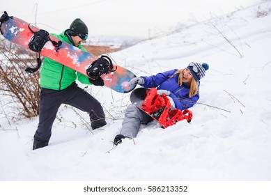 Gay Couple Snowboarders Posing For A Photograph