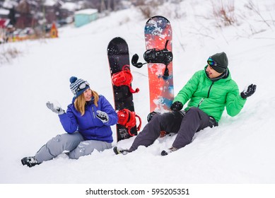 Gay Couple Snowboarders Posing For A Photograph