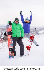 Gay Couple Snowboarders Posing For A Photograph