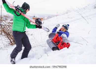 Gay Couple Snowboarders Posing For A Photograph