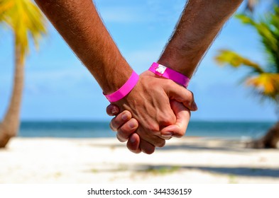 Gay Couple Travel Close Up Holding Hands Watching On The Beach